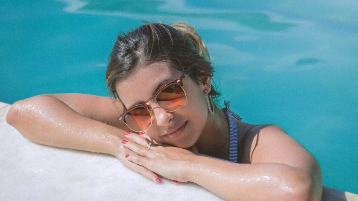 Woman Leaning on Poolside