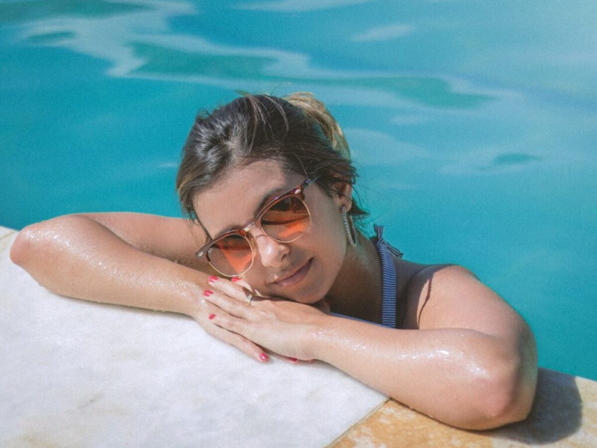 Woman Leaning on Poolside