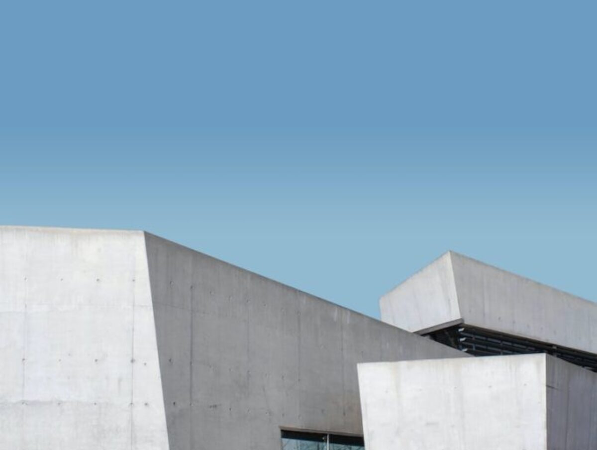 white concrete building under blue sky during daytime
