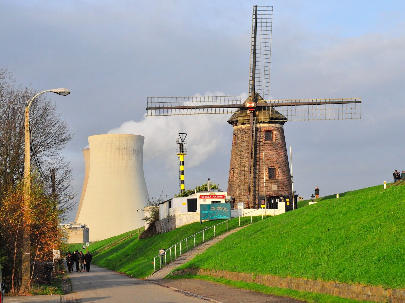 brown concrete tower near green grass field during daytime