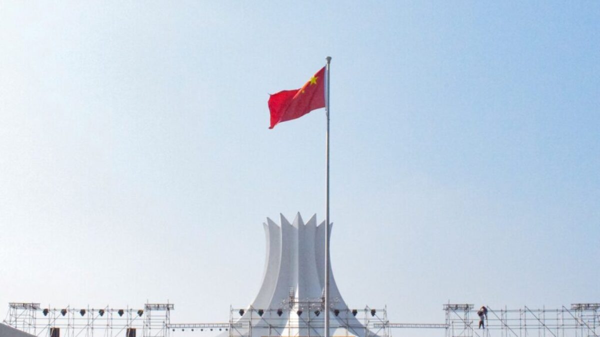 red white and blue flag on pole during daytime
