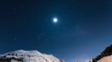 white mountain under starry night