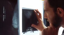 person holding black tablet computer