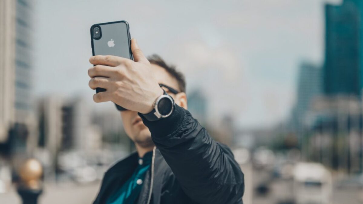 person takes photo