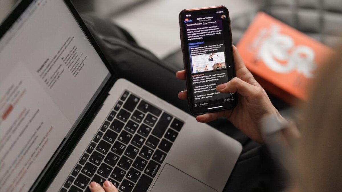 person holding black iphone 4