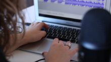 woman using MacBook Air in room