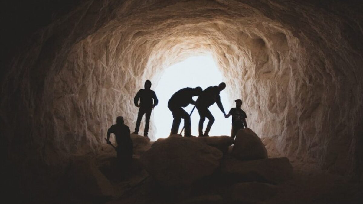 photo of people in cave