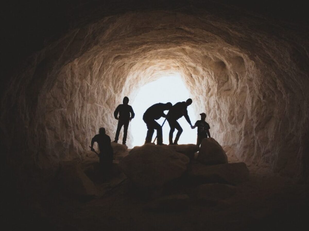 photo of people in cave
