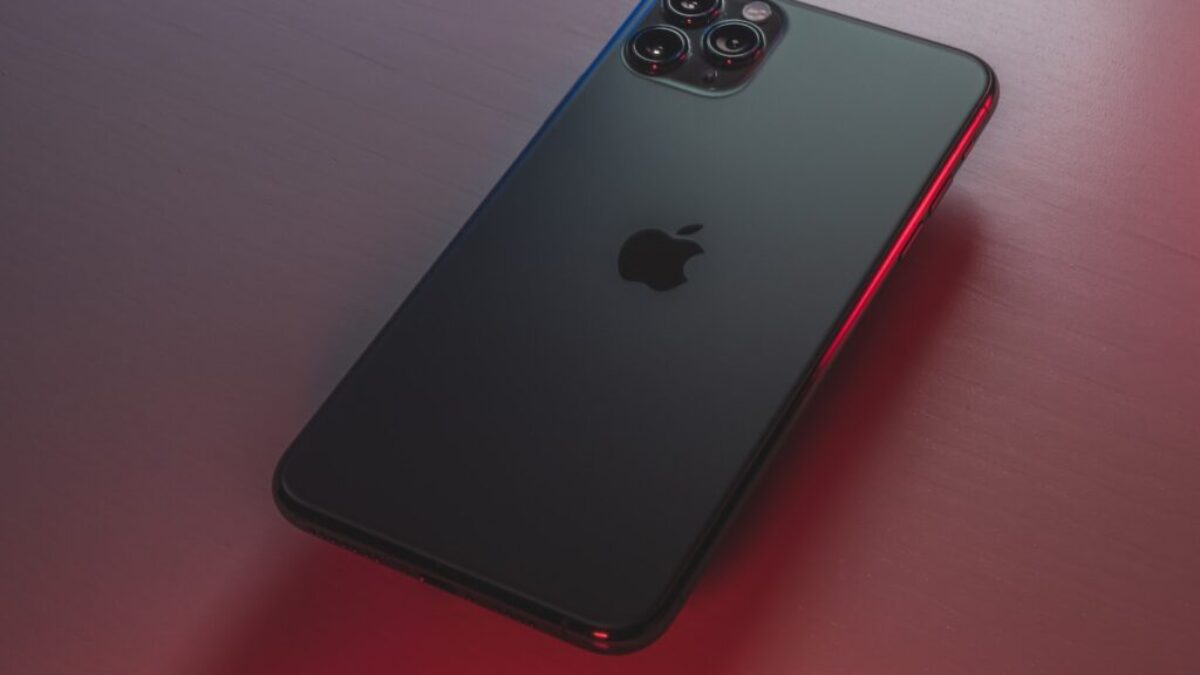 black iphone 7 plus on red table