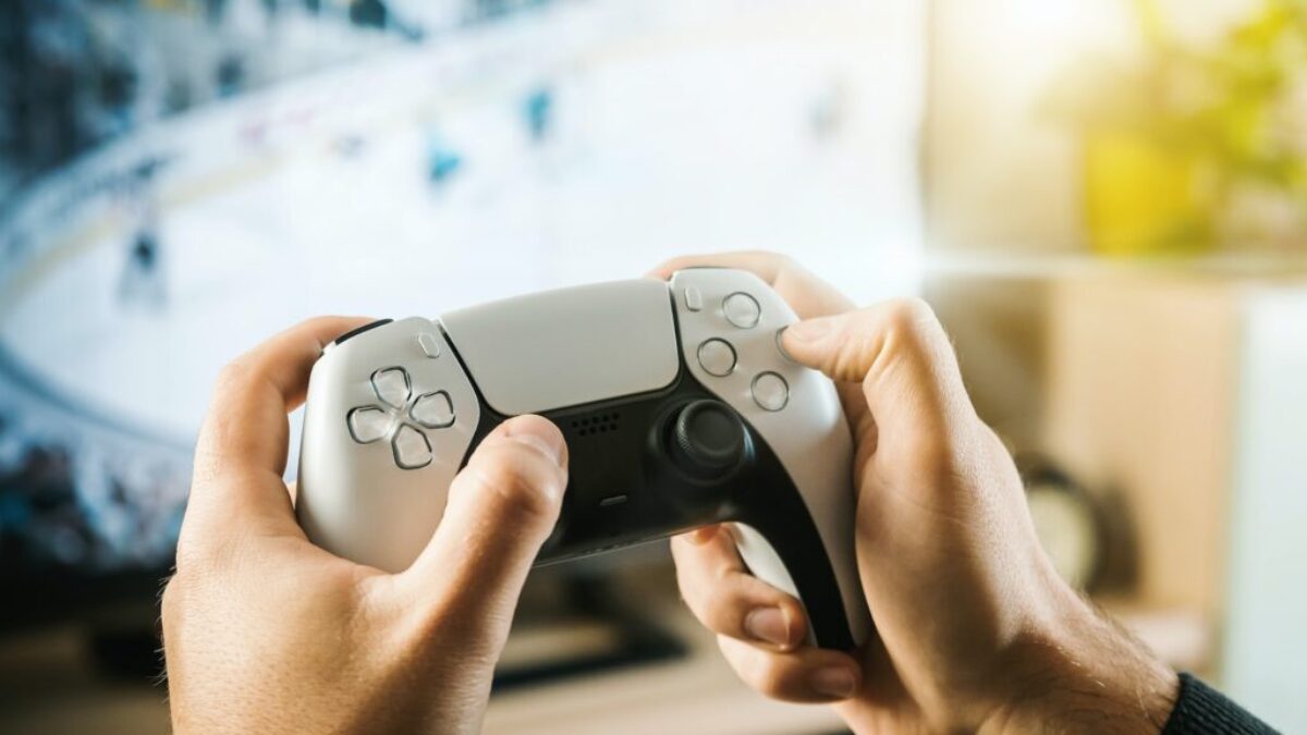 person holding black game controller