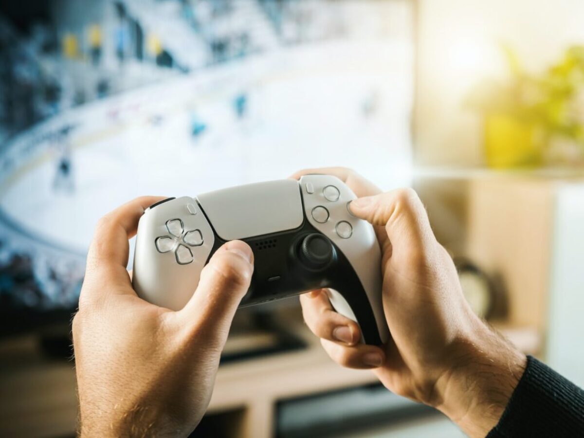 person holding black game controller