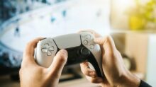 person holding black game controller