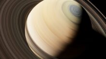 a close up of a saturn planet with a black background