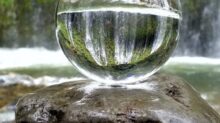 clear glass ball on brown rock