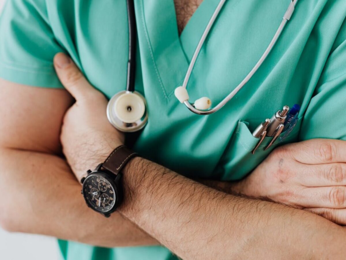 Crop doctor with stethoscope in hospital