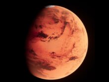 a red planet with a black background