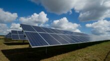 solar panels on green field