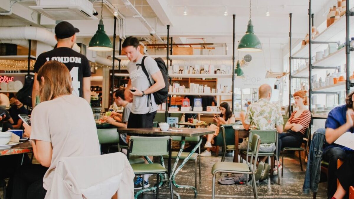 people eating inside of cafeteria during daytime