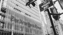 grayscale photo of city buildings