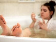 person in bathtub with water