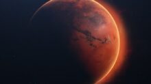 a red planet with a star in the background