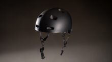 a black helmet with holes on the side of it