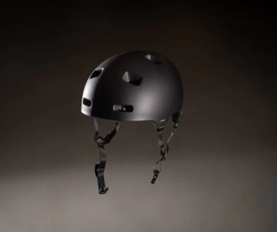 a black helmet with holes on the side of it