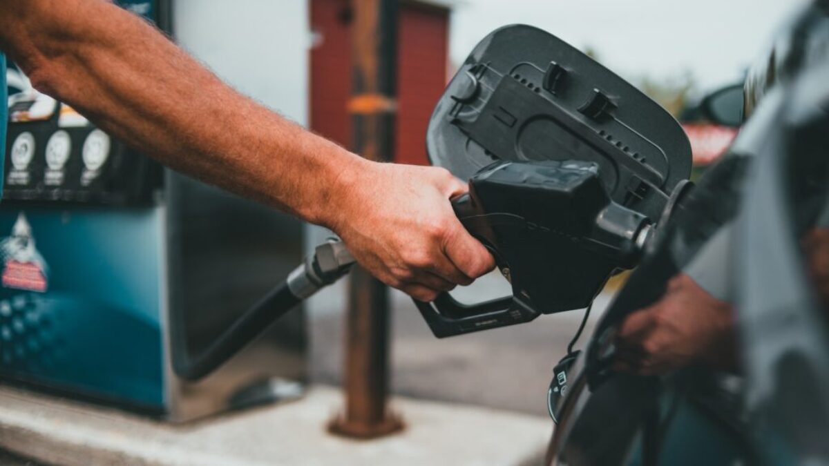 person holding black corded device