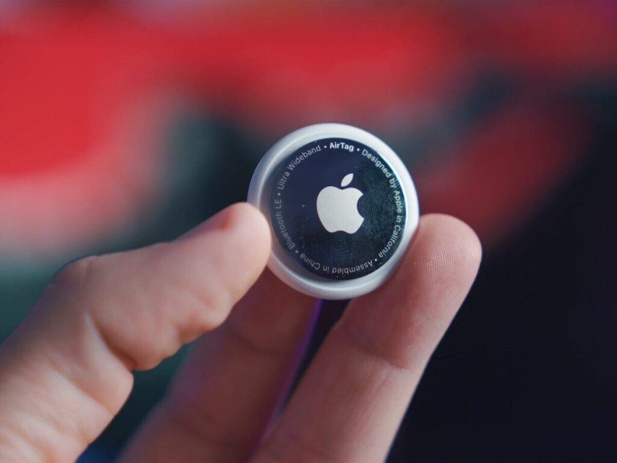 person holding black and white round plastic