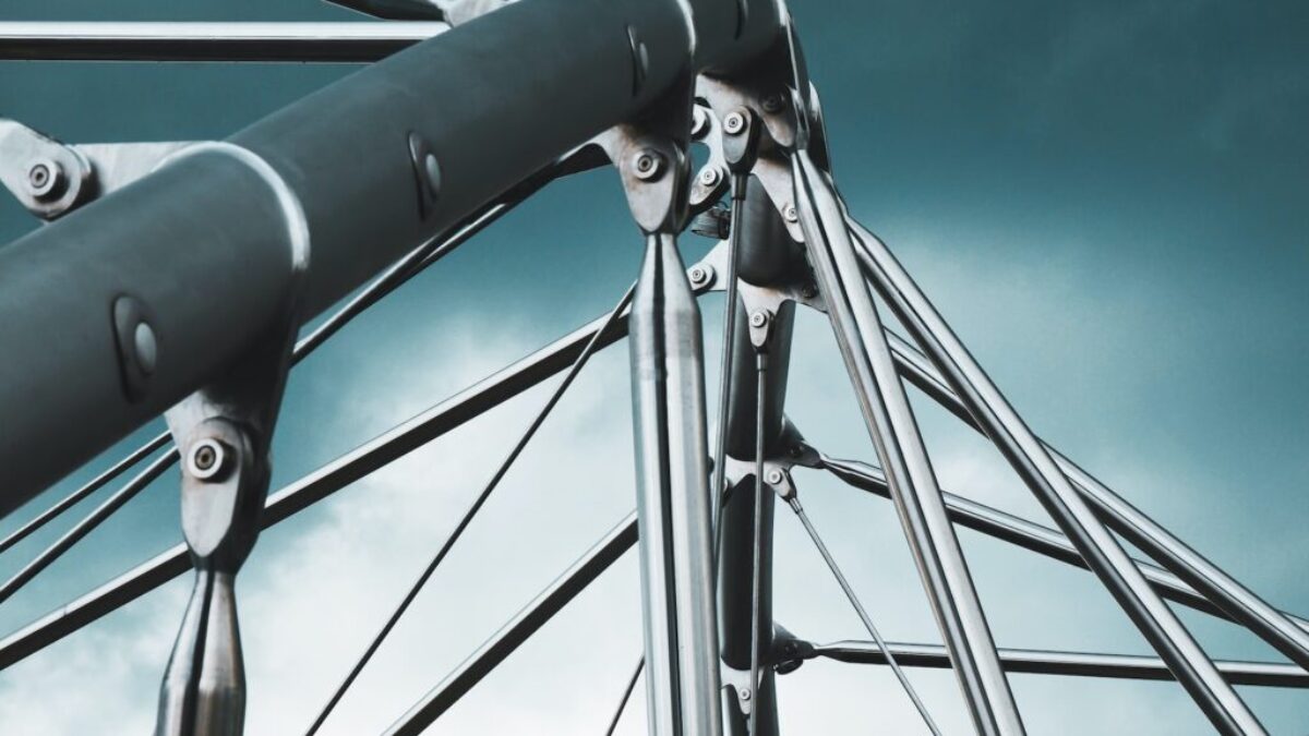 a close up of a metal structure against a cloudy sky