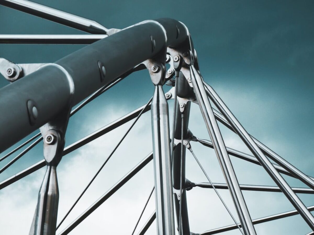 a close up of a metal structure against a cloudy sky