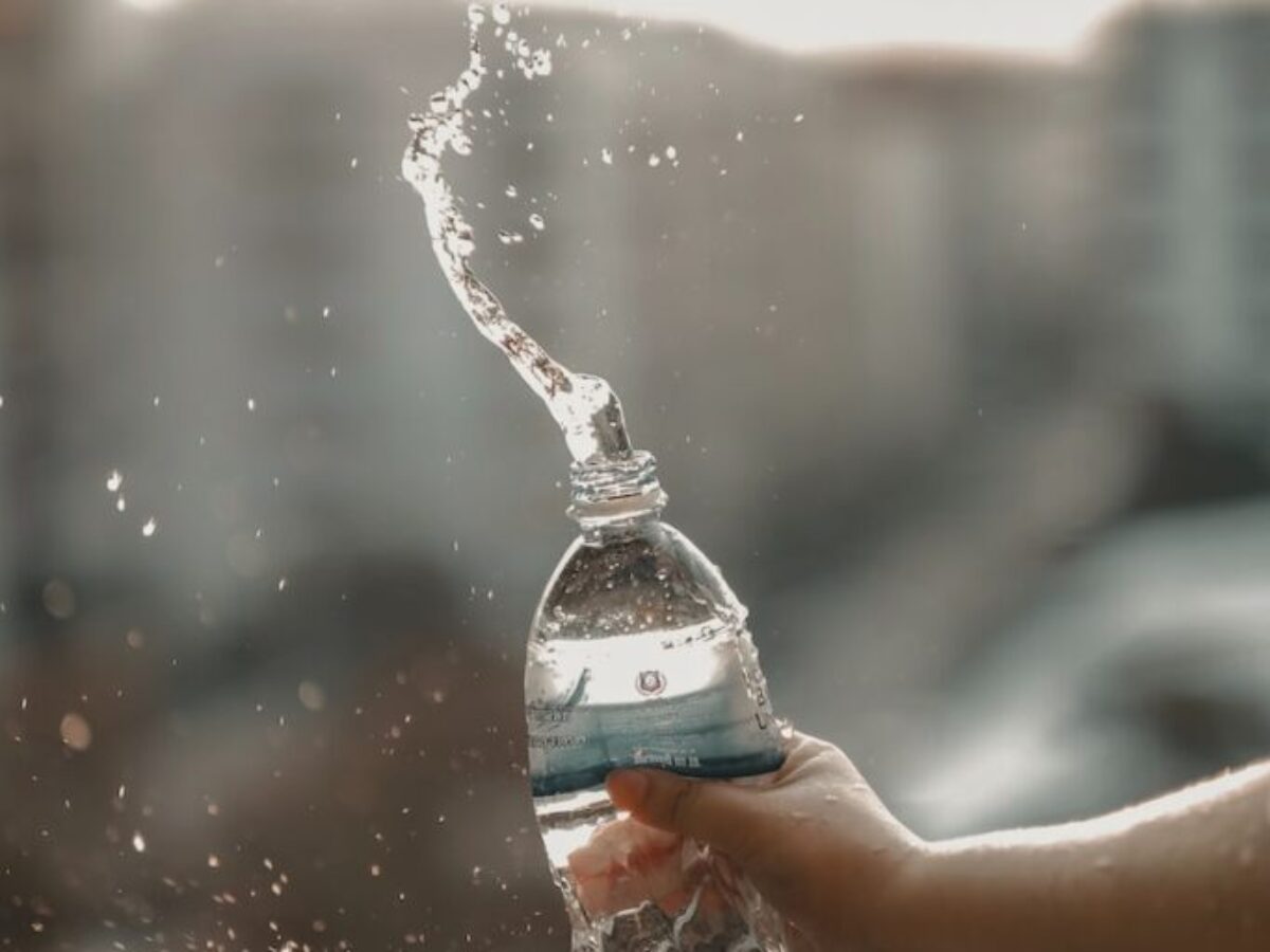 white and blue labeled disposable bottled water