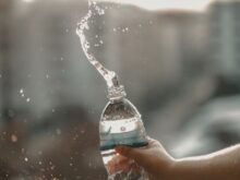 white and blue labeled disposable bottled water