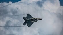 a fighter jet flying through the air