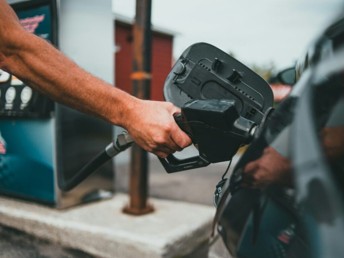 person holding black corded device