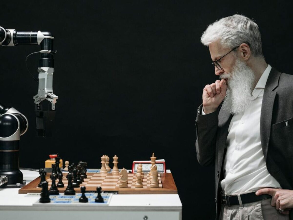 Elderly Man Thinking while Looking at a Chessboard
