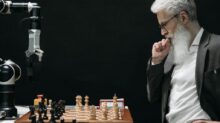 Elderly Man Thinking while Looking at a Chessboard