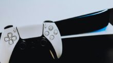 a close up of two video game controllers