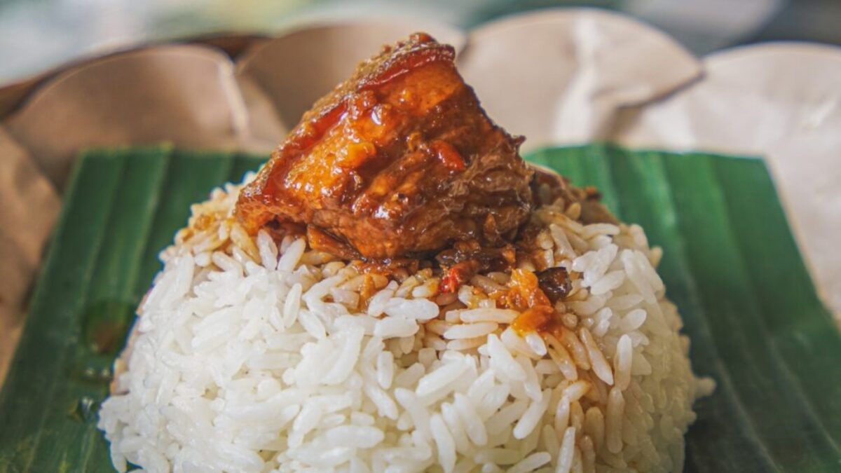 steamed rice with adobong pork on top