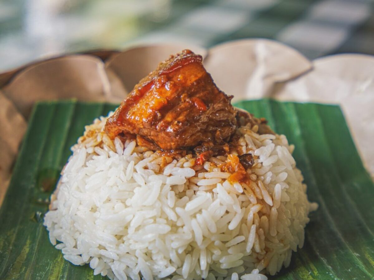 steamed rice with adobong pork on top