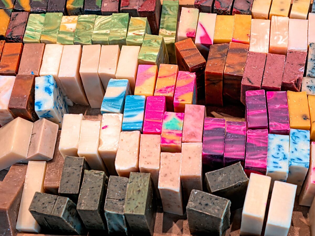 a pile of different colored soaps sitting on top of each other