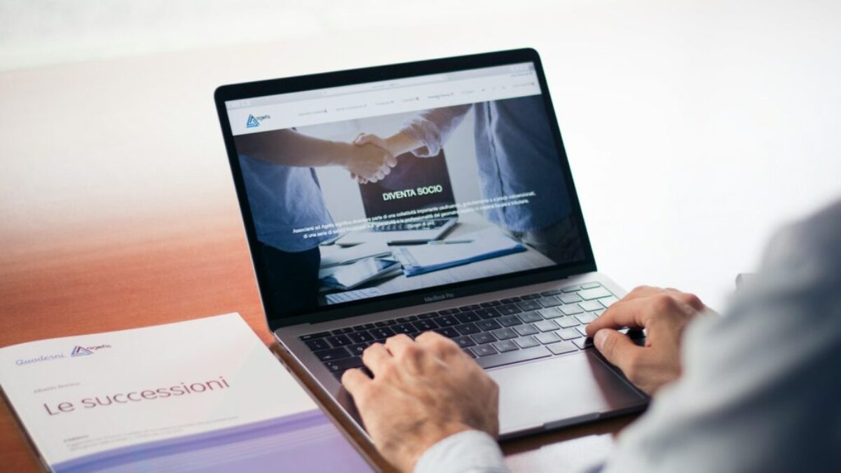 man's hands on MacBook Pro