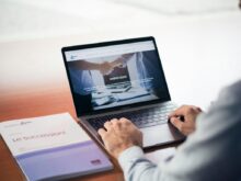 man's hands on MacBook Pro