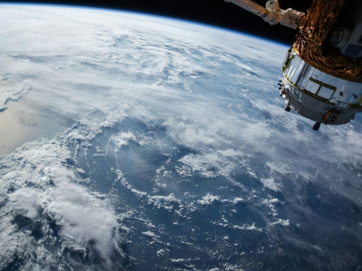 view of Earth and satellite