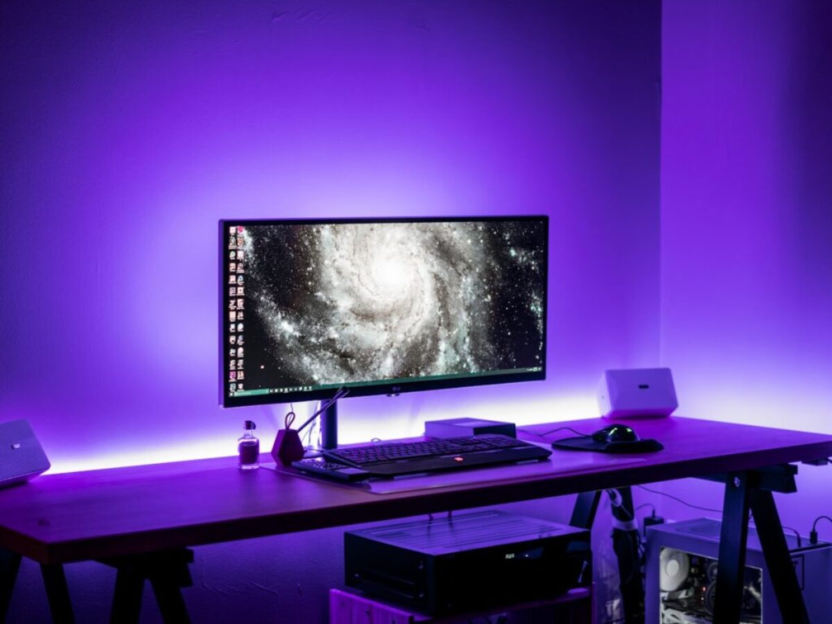 flat screen computer monitor on brown computer desk