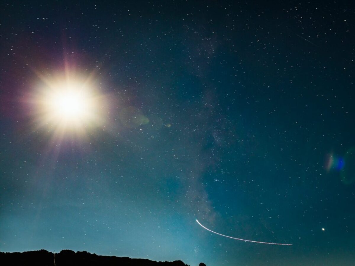 silhouette of mountain under blue sky during night time