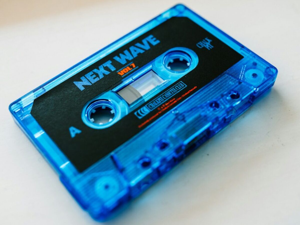 a blue tape recorder sitting on top of a table