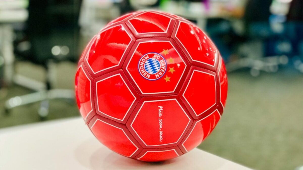 red soccer ball on white table