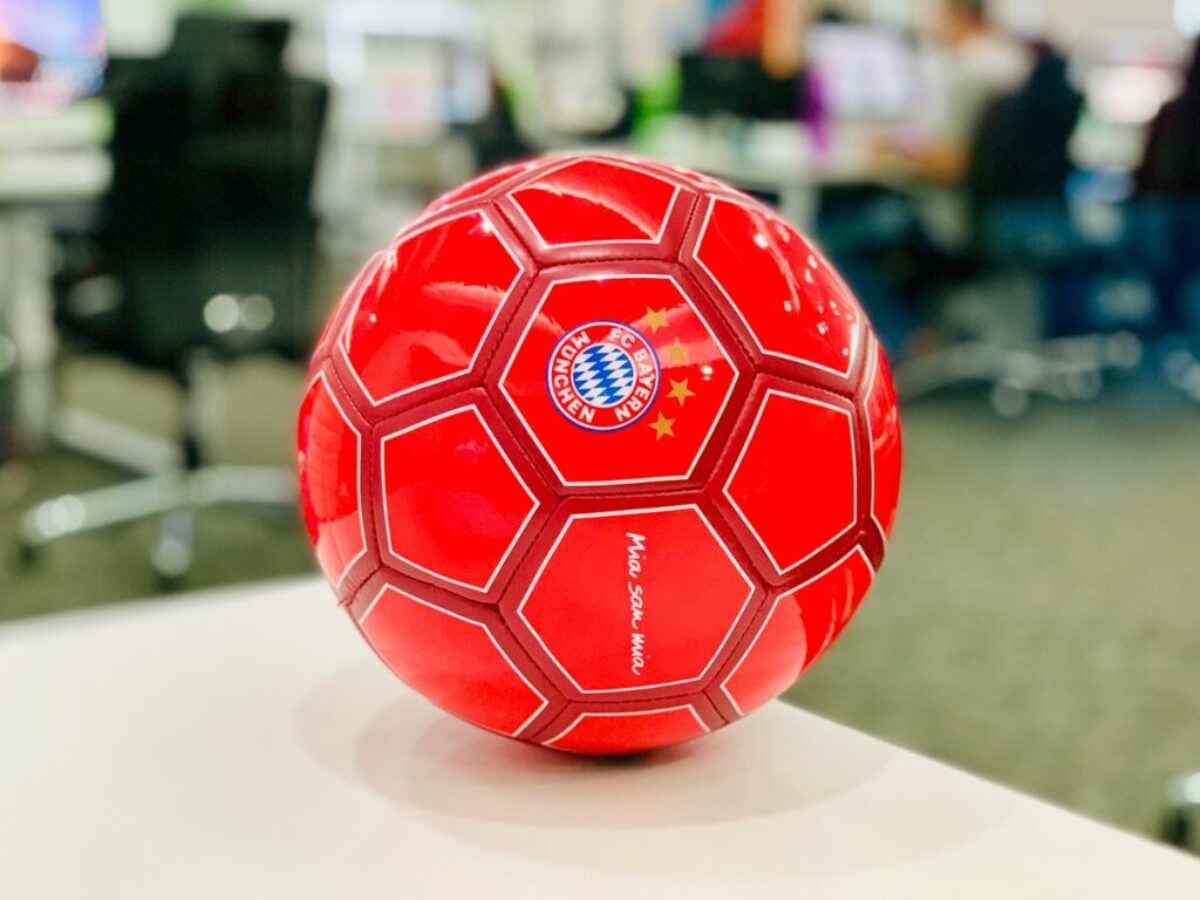 red soccer ball on white table