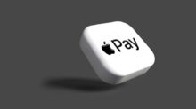 a white dice with the word pay on it